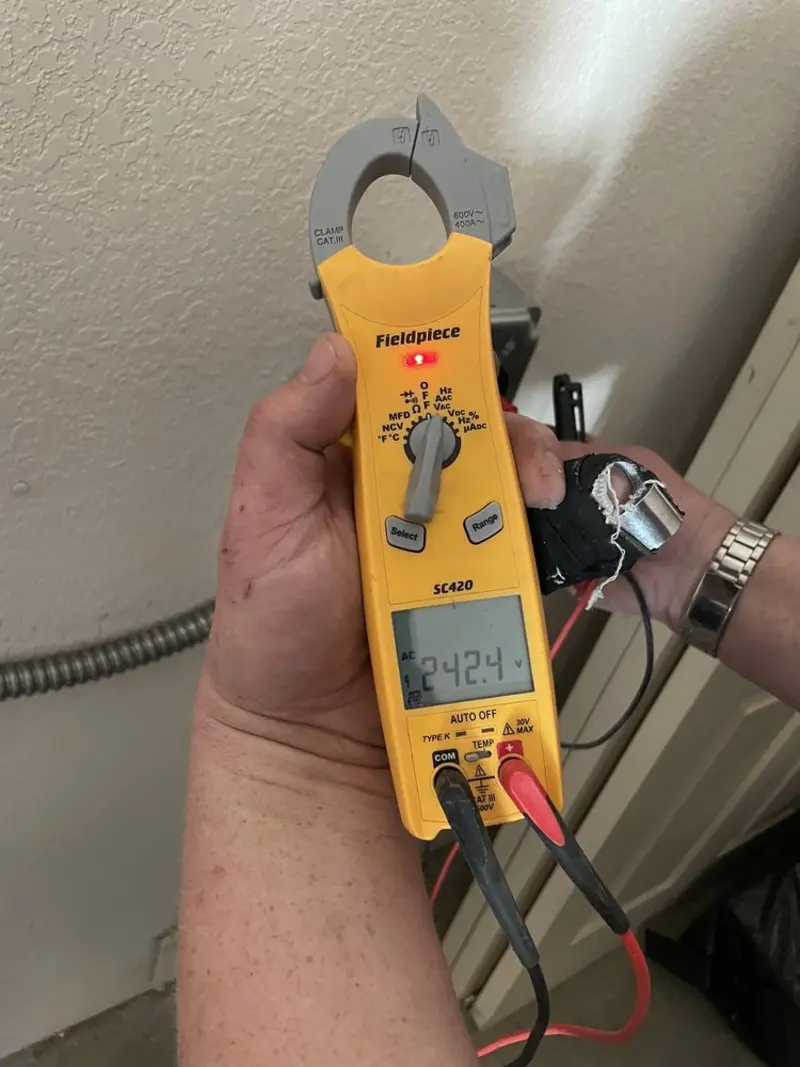 Voltage testing with clamp meter during Electrical Installation Services in Fountain Valley